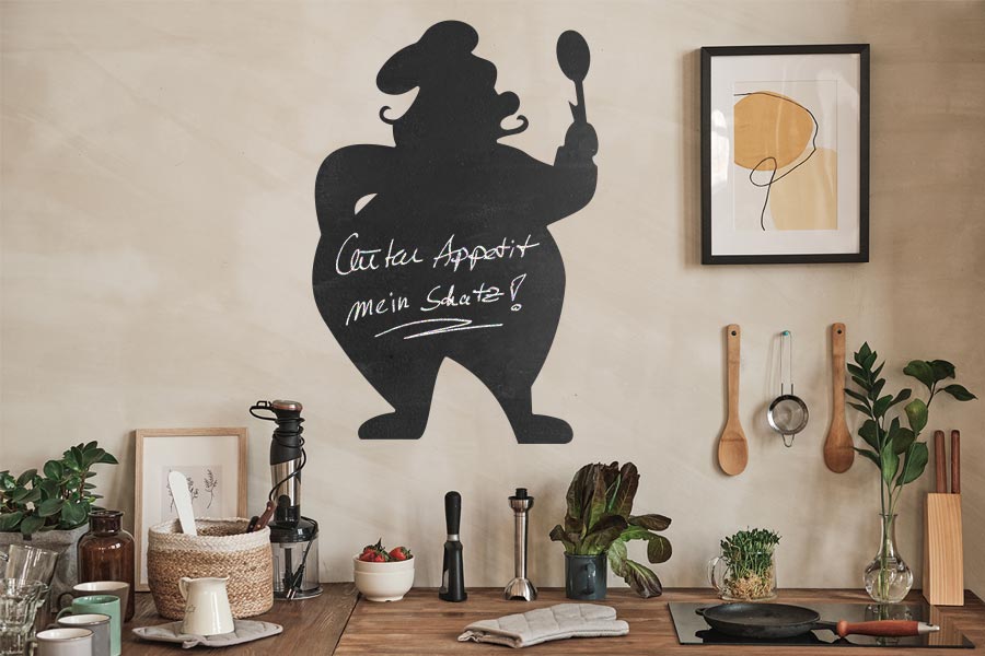 tafelfolienmotiv mit dickem koch auf küchenwand